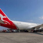Qantas aircraft Dreamliner parked at airport gate