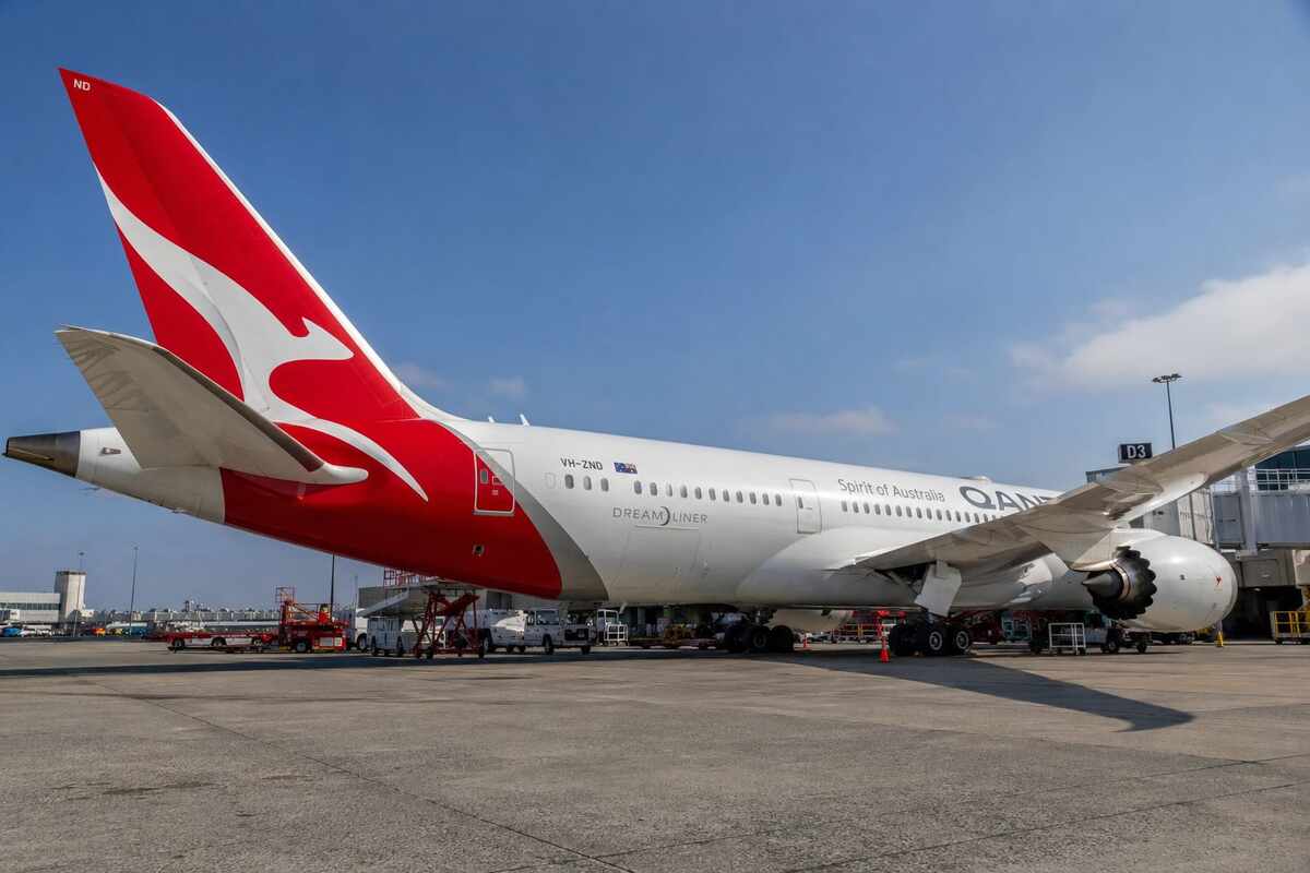 Qantas aircraft Dreamliner parked at airport gate